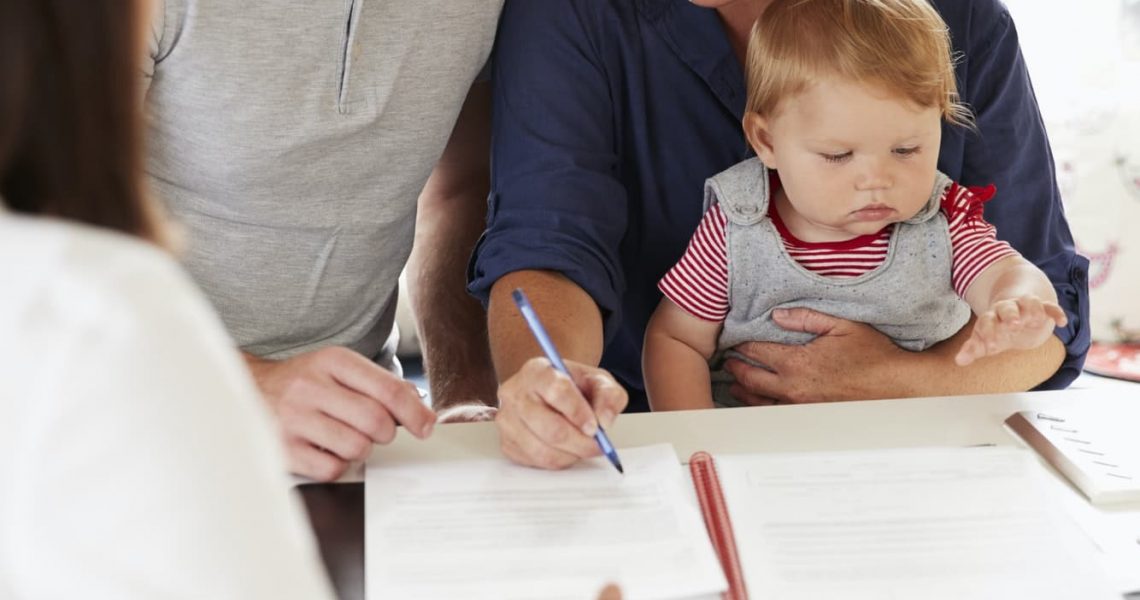 family-with-baby-meeting-financial-advisor-at-home.jpg